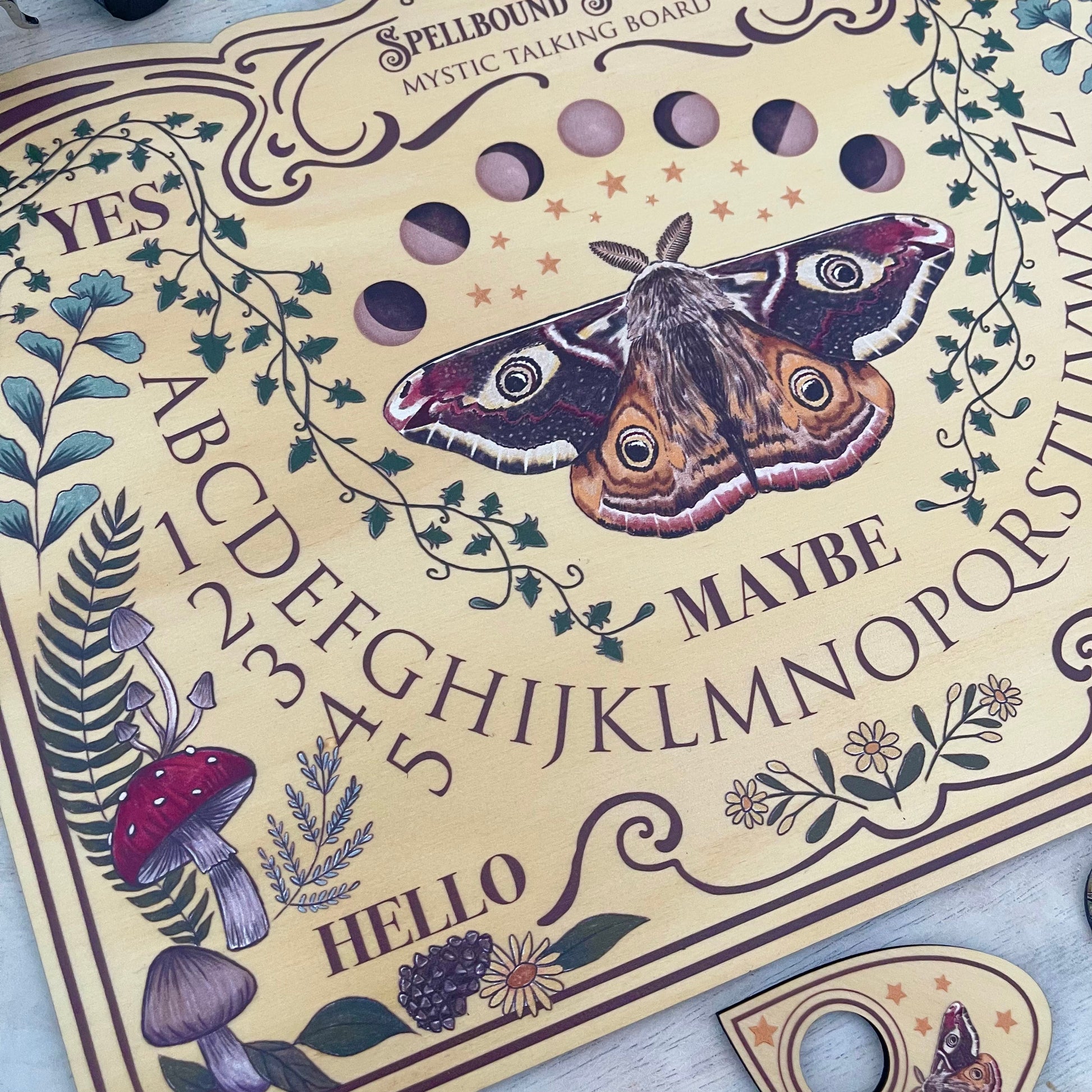 Beautiful hand-drawn light moth and mushroom ouija board spirit board for witchcraft